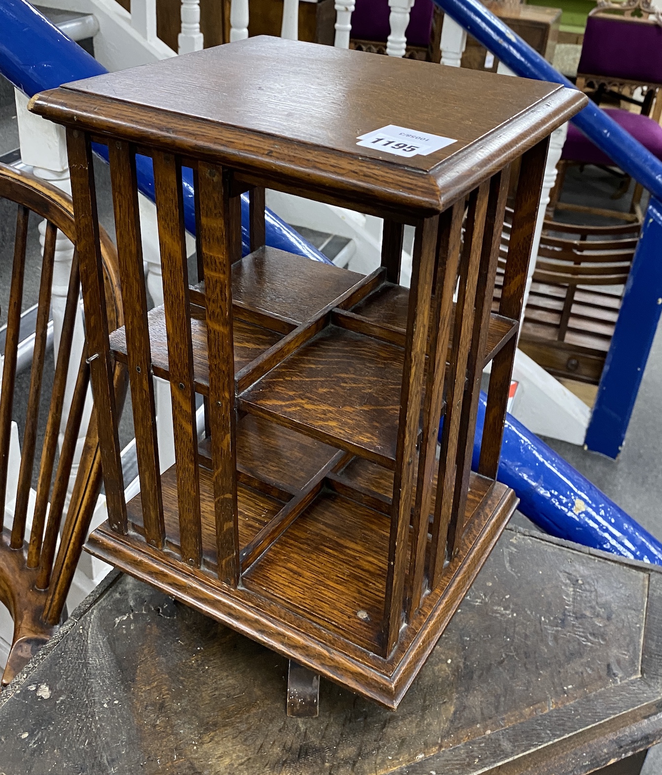 An early 20th century miniature oak revolving bookcase, width 26cm, height 43cm